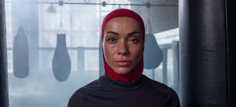 A Muslim woman in a boxing gym during boxing classes uae