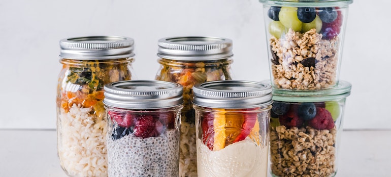 Healthy meals in glass containers showing meal prep as a way to stay motivated on your fitness journey