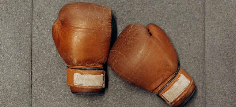 Boxing gloves on a grey background.
