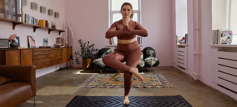 A woman doing yoga in her home. 