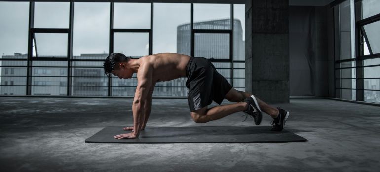 A person doing a plank, which is one of Core Stability Exercises Favored in Abu Dhabi