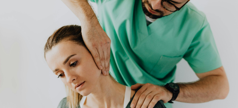 a doctor helping a patient safely return to exercise after an injury 