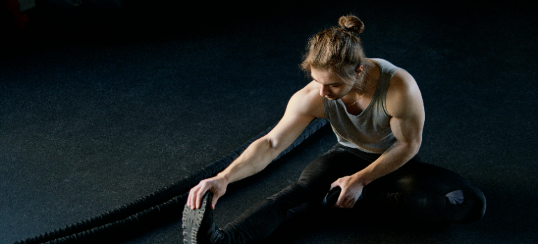 a man doing leg stretches