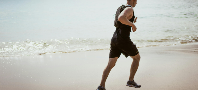 a person running on the beach