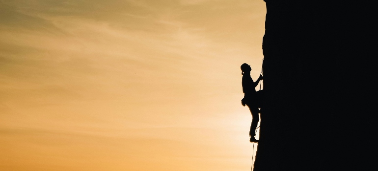 A person climbing a rock