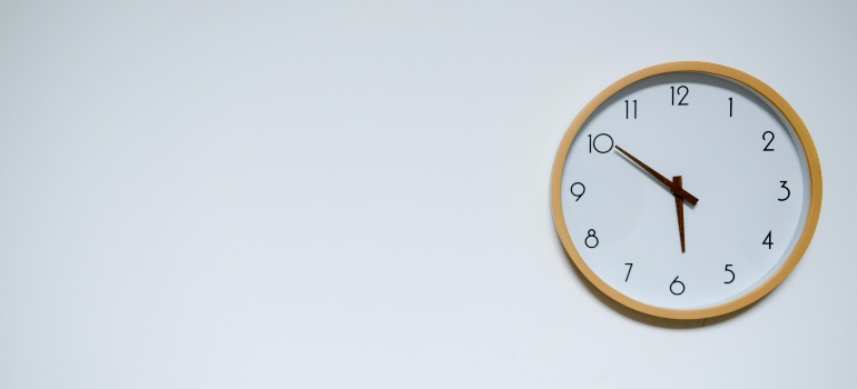 a clock placed on a white wall