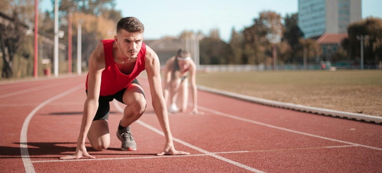 a man and a woman getting ready to run