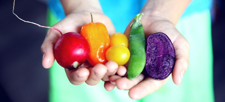 Man holding vegetables.