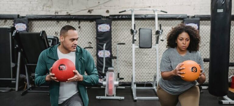 A woman training with personal trainer