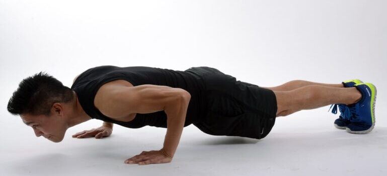 A man doing one of the trending bodyweight exercises in Abu Dhabi