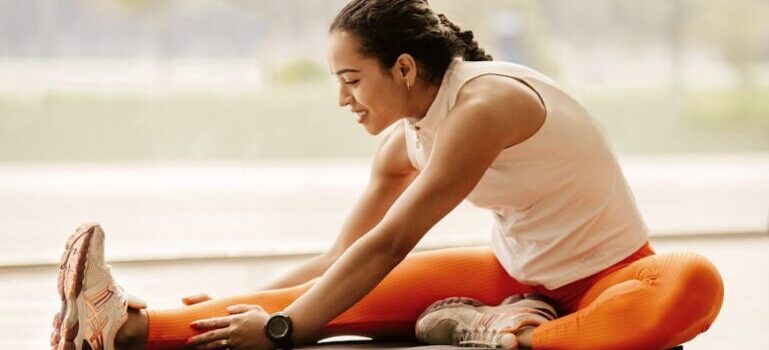 A woman stretching for effective 10-minute ab routines