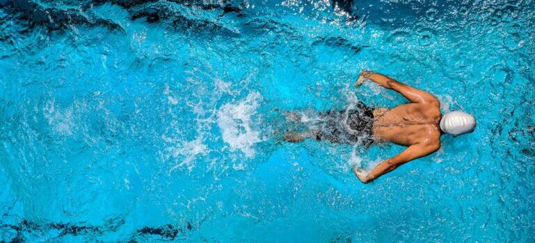 A person swimming in a pool