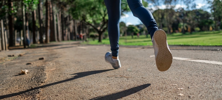 A person jogs in the park and exploring top running tracks and their amenities in Dubai