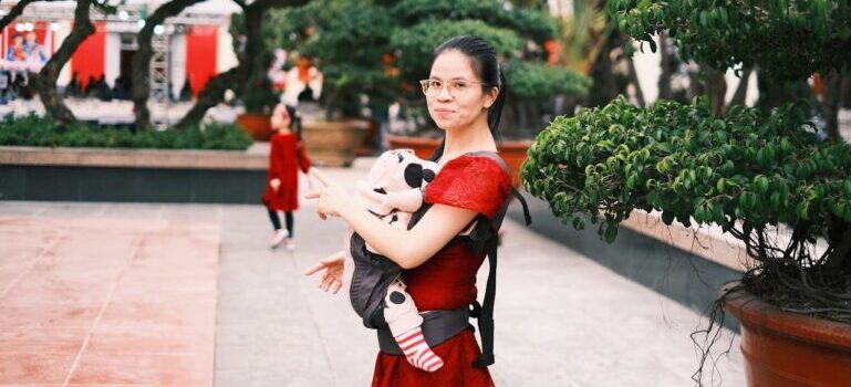 A mother holding a baby 