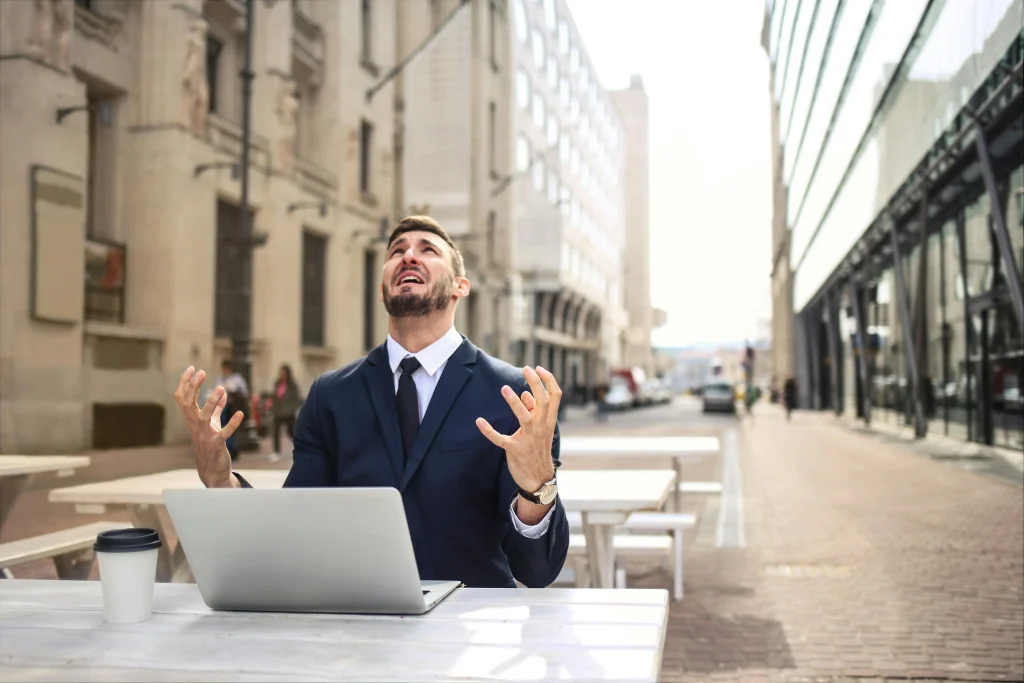 A man stressing over work.