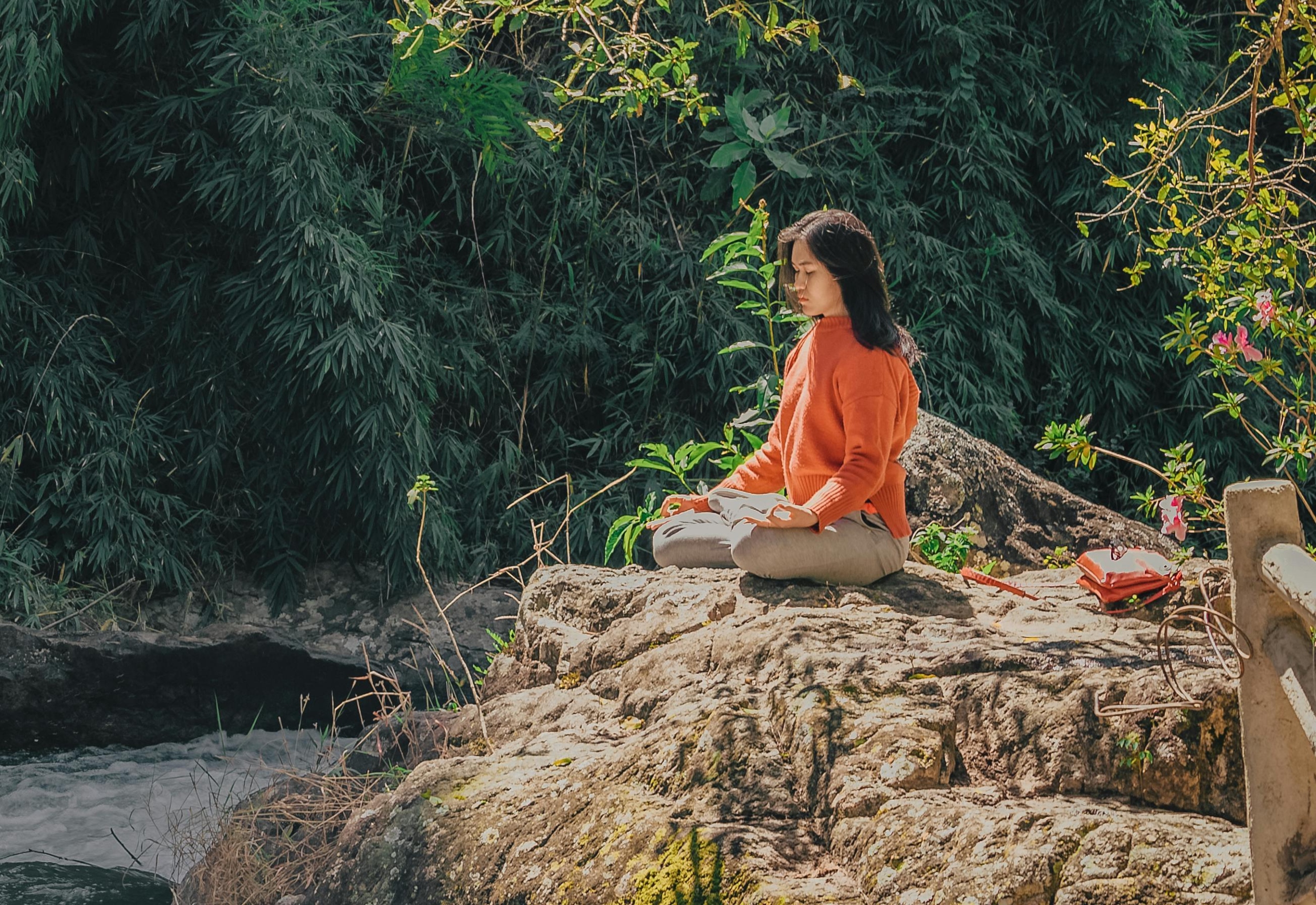 a woman doing one of the types of yoga offered in Ajman