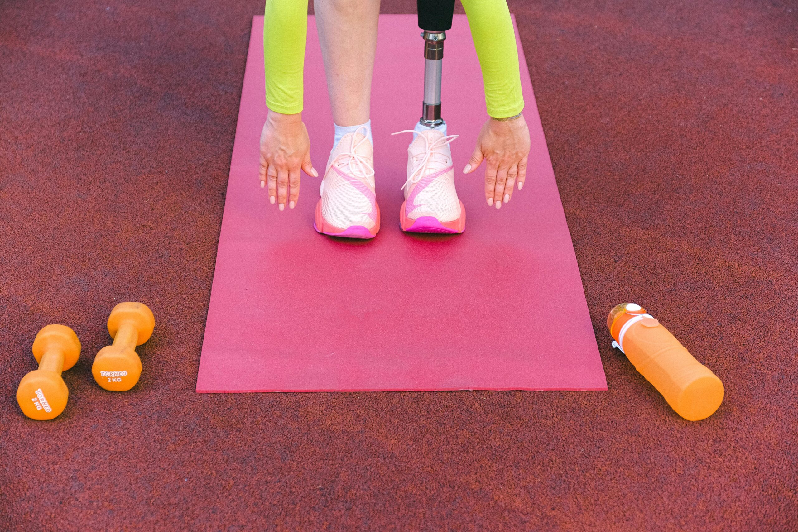 a woman on a yoga mat doing an exercise from a circuit training workouts routine