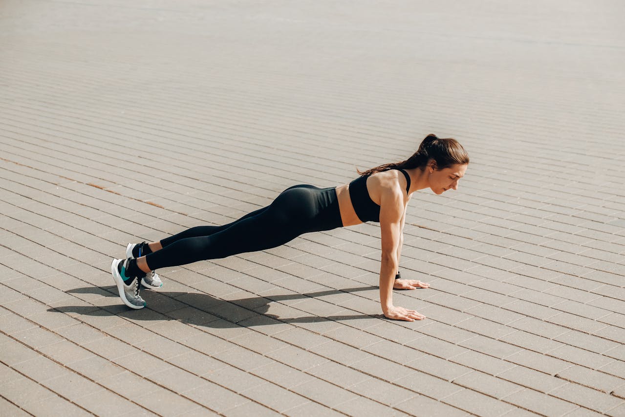 A woman exercising after learning about calisthenics practices in Ras Al Khaimah