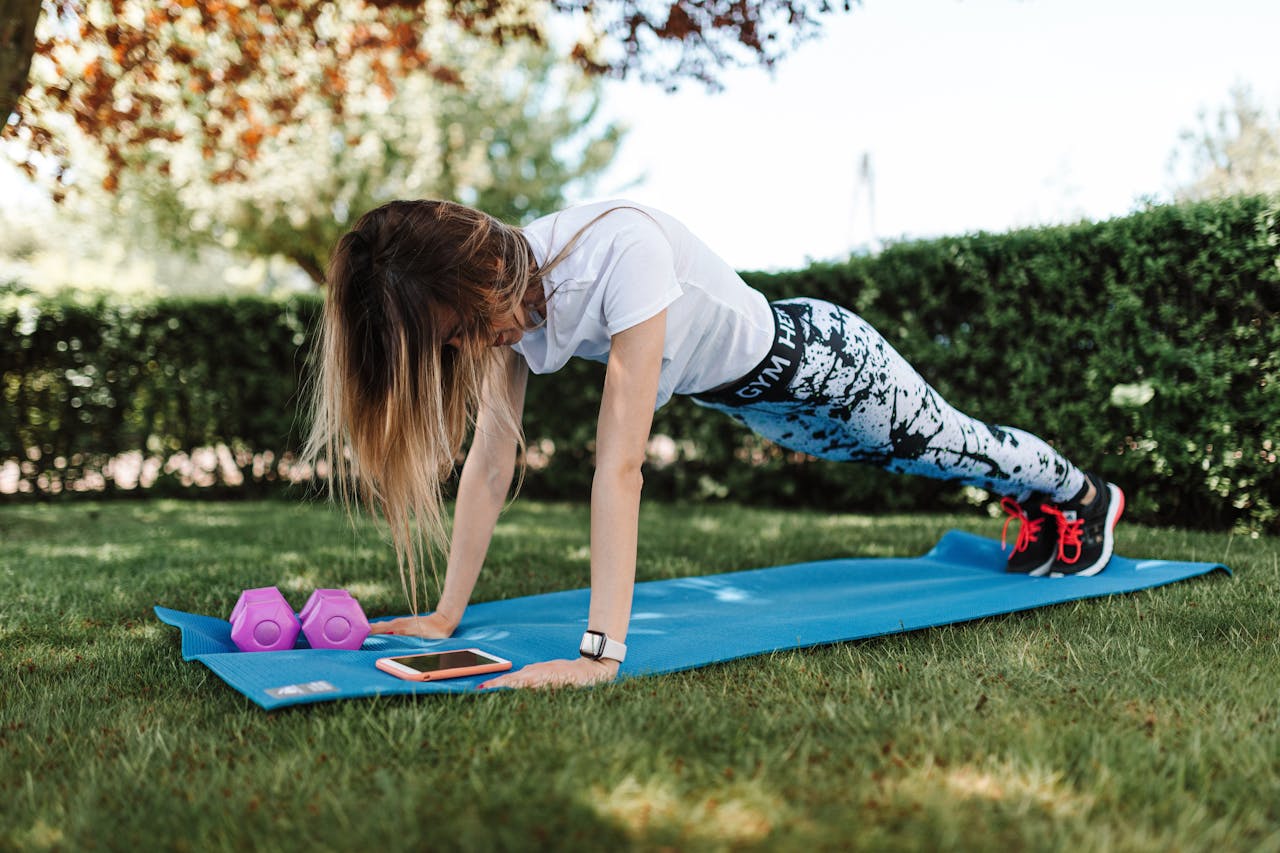 A woman exercising in one of the best Calisthenics Parks in Abu Dhabi