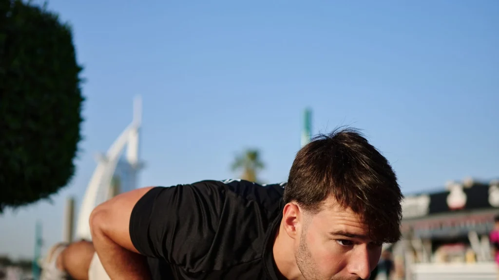 FitForce personal trainer, outdoor workout at Umm Suqeim beach with Burj Al Arab, Dubai