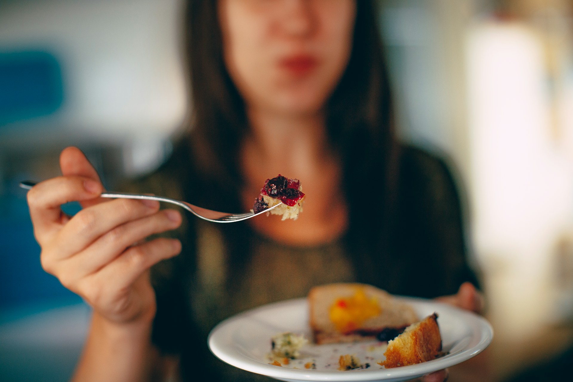 Person holding food on a fork