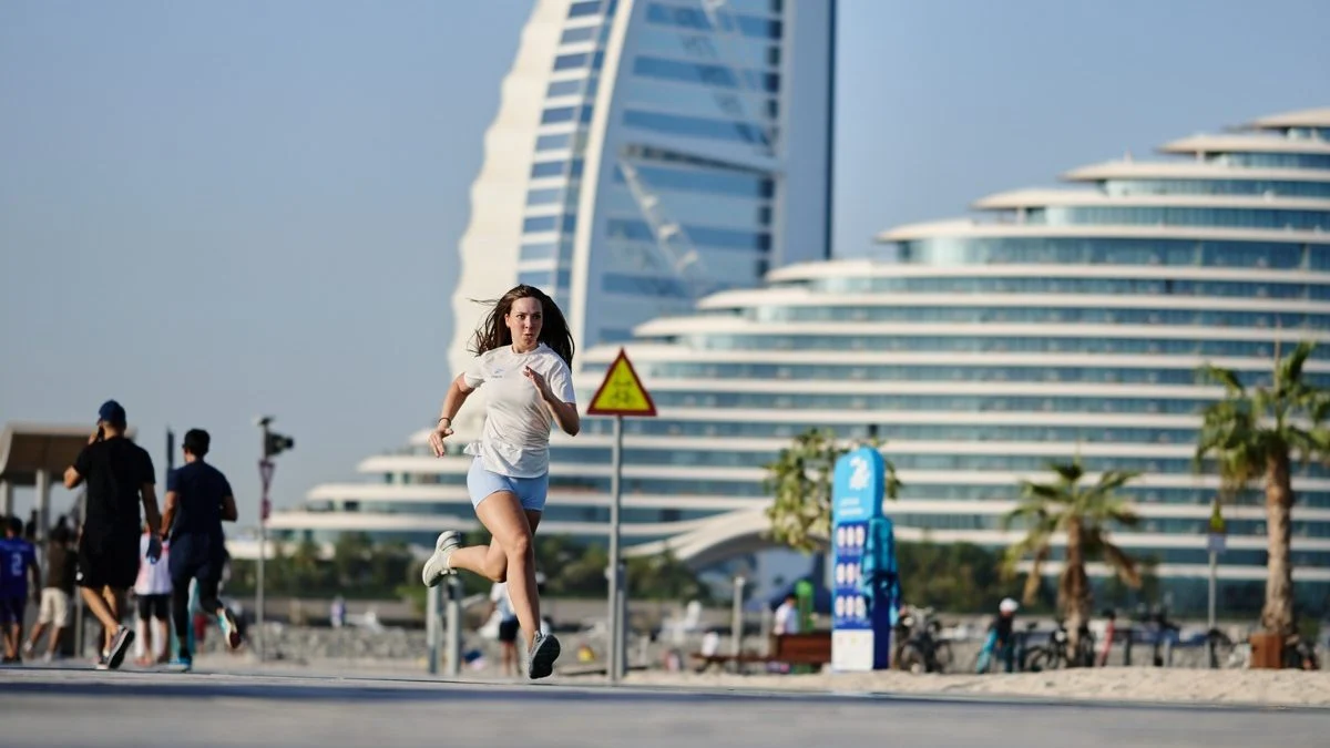 Morning run along the Dubai beachfront with the Burj Al Arab behind