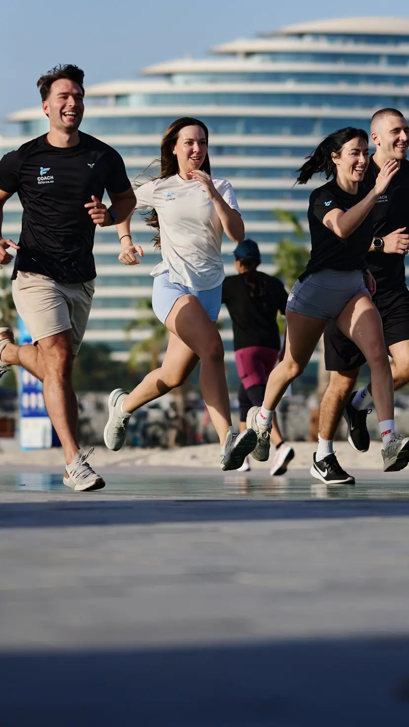 FitForce personal trainers on a group run at Umm Suqeim beach, Dubai